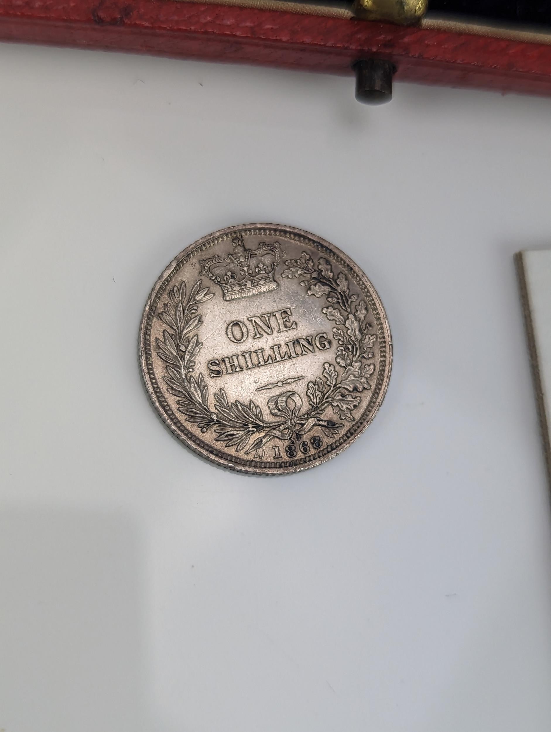 A collection of Victorian and later coins to include a 1887 Florin, 1868 Shilling, along with a - Image 5 of 12