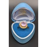 A 9ct gold ring set with a pink coloured stone, total weight 3.7g Location: