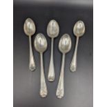 Five silver teaspoons, four having golf club detail to the top, total weight 74g Location: