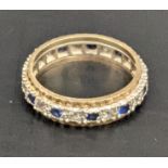 A yellow metal ring set with blue and white sapphires, total weight 3.2g Location: