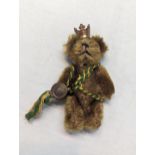 A 1940's miniature Schuco Promotional teddy bear for BP (British Petroleum), wearing a crown and