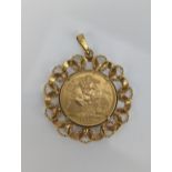 United Kingdom - Elizabeth II (1952-2022) sovereign, dated 1974, in a 9ct gold pendant mount, 10.