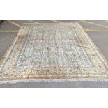 A handwoven silk Turkish carpet having geometric designs with multi guard borders and tasselled ends