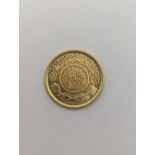 A jewellers restrike 'Commercial Copy' of a Saudi Arabian one Gunagh, testing as 22ct gold, 7.9g