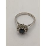 An 18ct white gold ring set with a sapphire and diamonds 4.4g, Location:RING