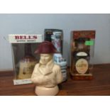 Four mixed bottles of spirits to include Bell's blended Scotch whisky, Gardhu whisky and Metaxa