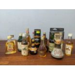 Twenty one miniature bottles to include Gordon's Gin, Famous Grouse, Bells, Glenfiddich, Grants