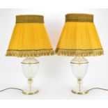 A pair of contemporary glass table lamps with gilt metal fittings, the ovoid bodies with pressed
