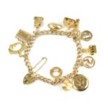 A 9ct yellow gold curb link charm bracelet, holding twelve charms including a house, a rugby ball, a