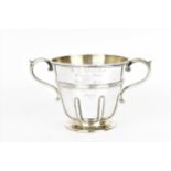 A George V silver twin-handled horse racing trophy cup by Pairpoint Brothers, London 1924, the front