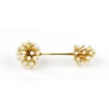 A French 18ct yellow gold and pearl jabot pin brooch, each end with pearl cluster on gold stems,