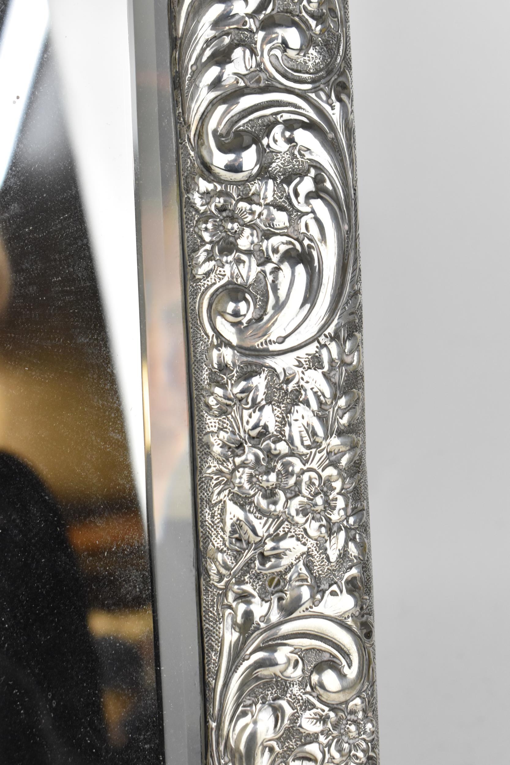 An Edwardian silver mounted dressing table mirror, Birmingham 1904, the frame with embossed c- - Image 4 of 9