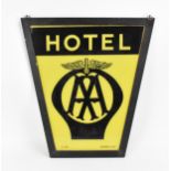 An AA Hotel painted glass sign, featuring a large 1930s AA badge in black on a yellow ground, by '