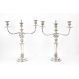 A pair of silver-plated Adam style candelabra, with twin-arms in a scroll and central light, the