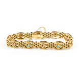 A 9ct yellow gold, seed pearl and turquoise brick-link bracelet, with open box clasp and safety