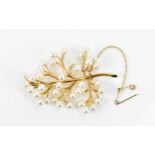 A yellow metal and fresh water pearl foliate brooch, modelled as a leafy branch with same-sized