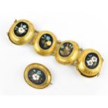 A Victorian yellow metal mounted pietra dura matching bracelet and brooch, with Etruscan style