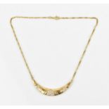 An 18ct yellow gold necklace, with attached crescent shaped pendant mounted with paste stones, on