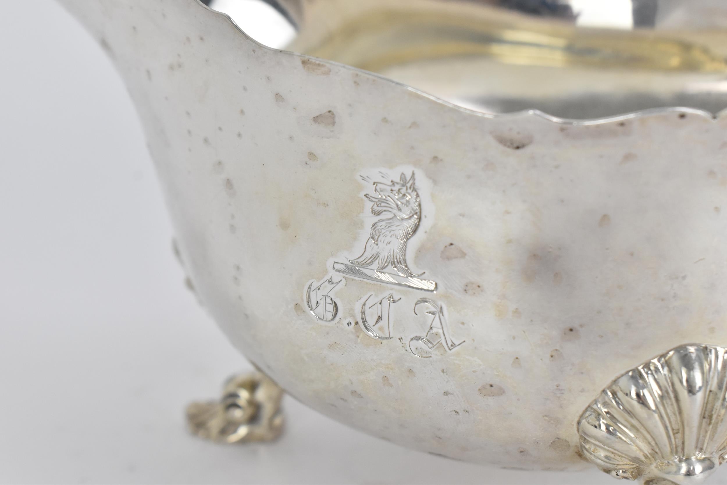A large George III silver sauce boat by Robert Garrard II, London 1825, with pinched rim and c- - Image 3 of 6