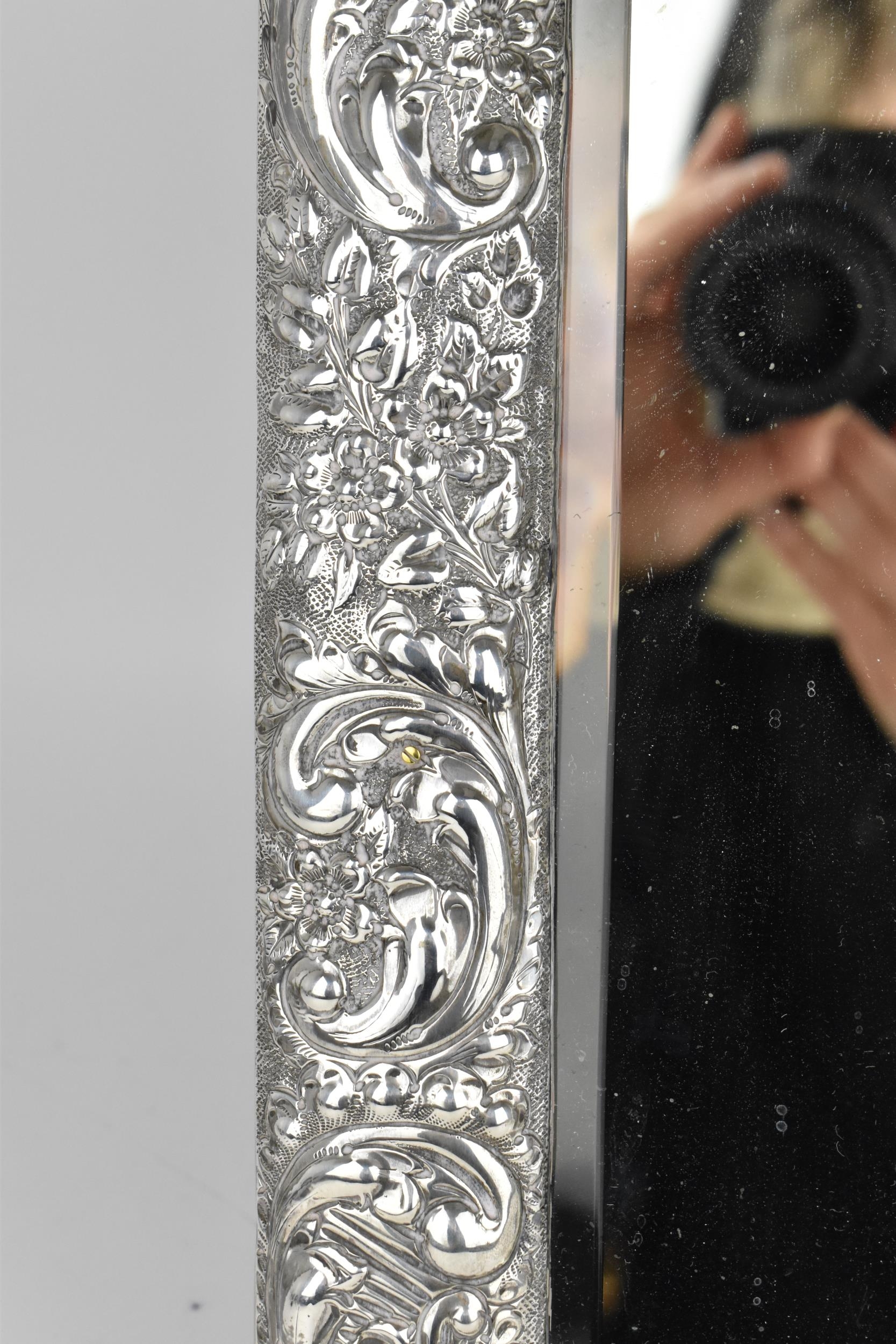 An Edwardian silver mounted dressing table mirror, Birmingham 1904, the frame with embossed c- - Image 5 of 9