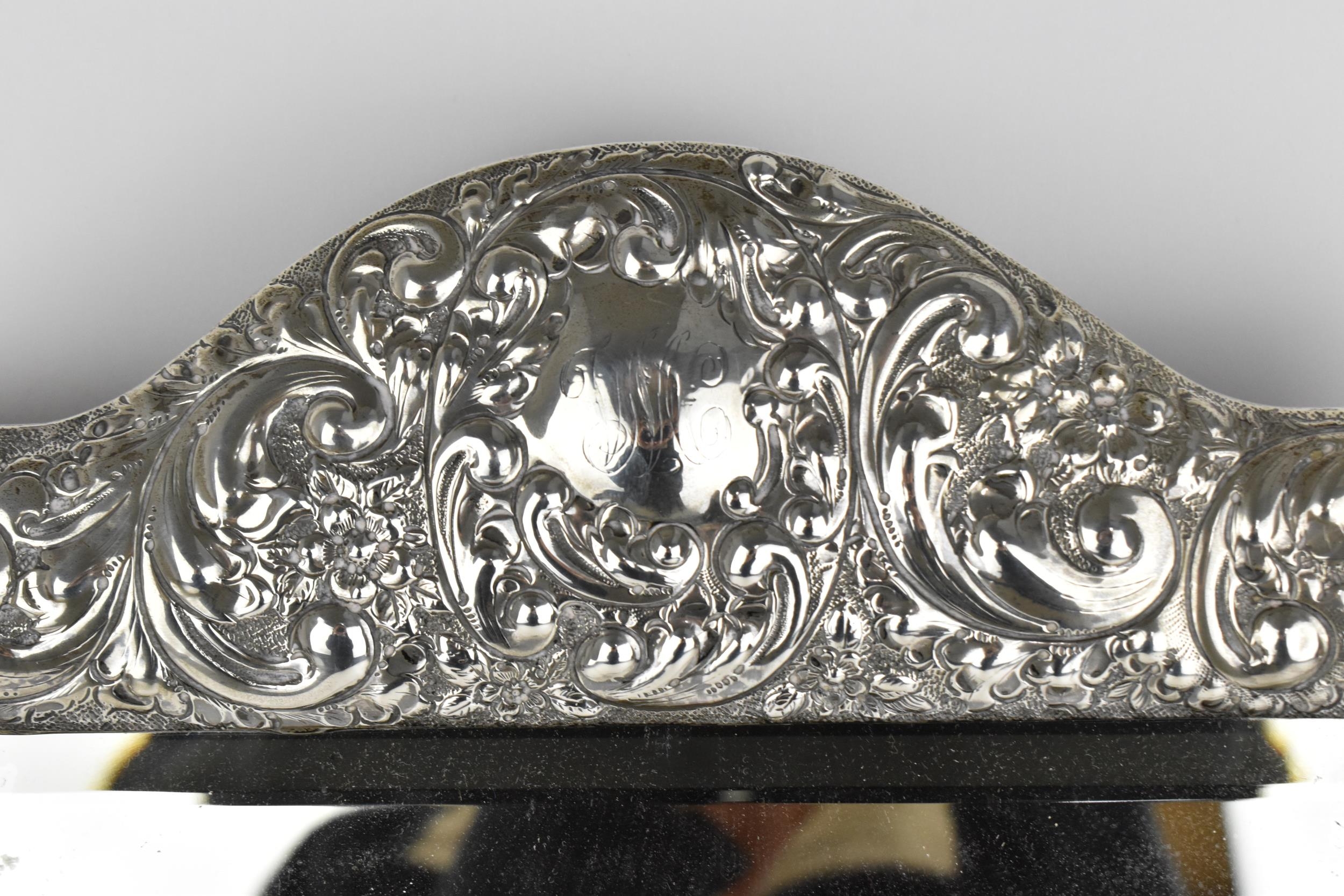 An Edwardian silver mounted dressing table mirror, Birmingham 1904, the frame with embossed c- - Image 3 of 9