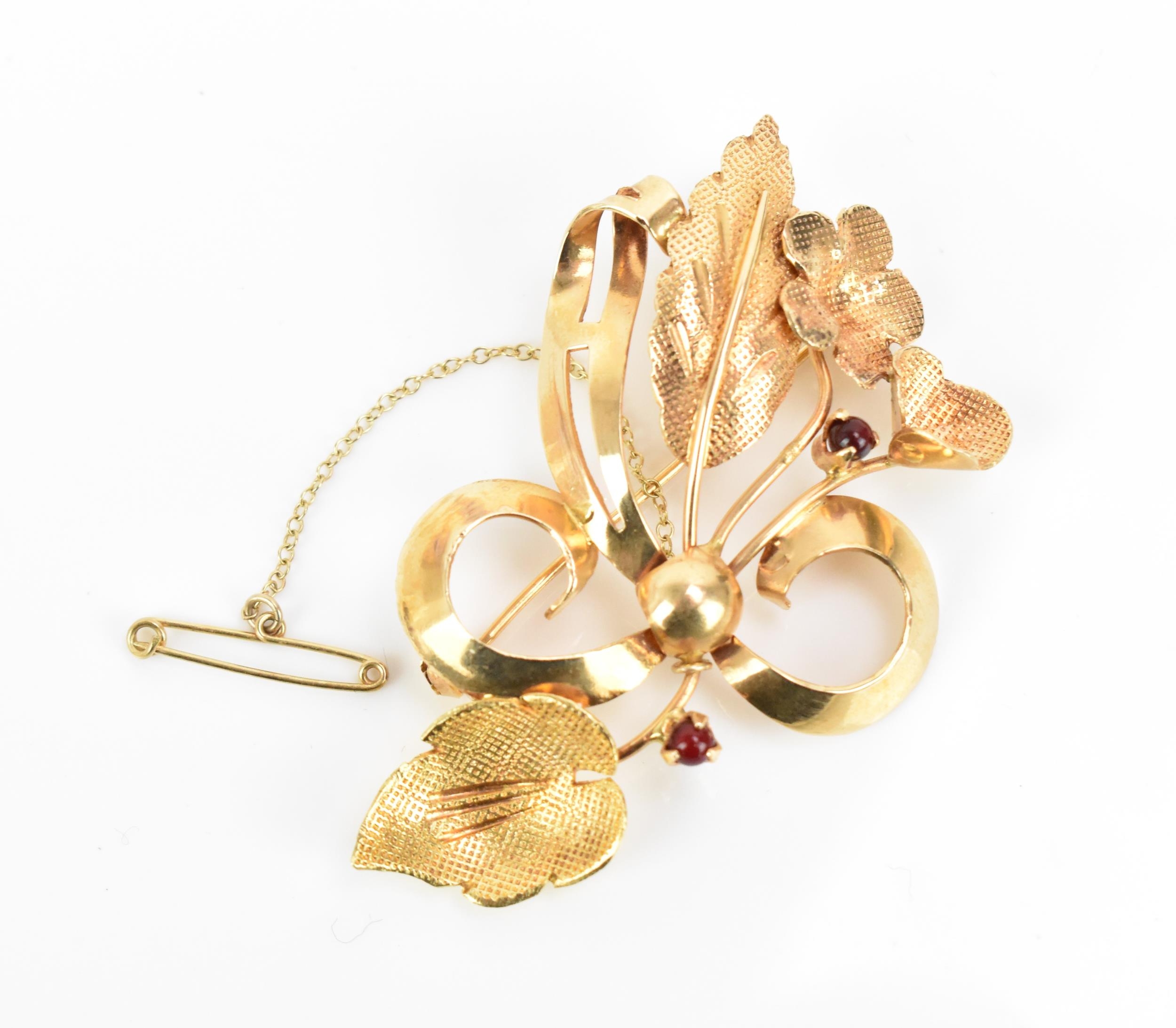 An Italian 18ct yellow gold and red stone floral brooch, designed as ribbon-tied bouquet, with