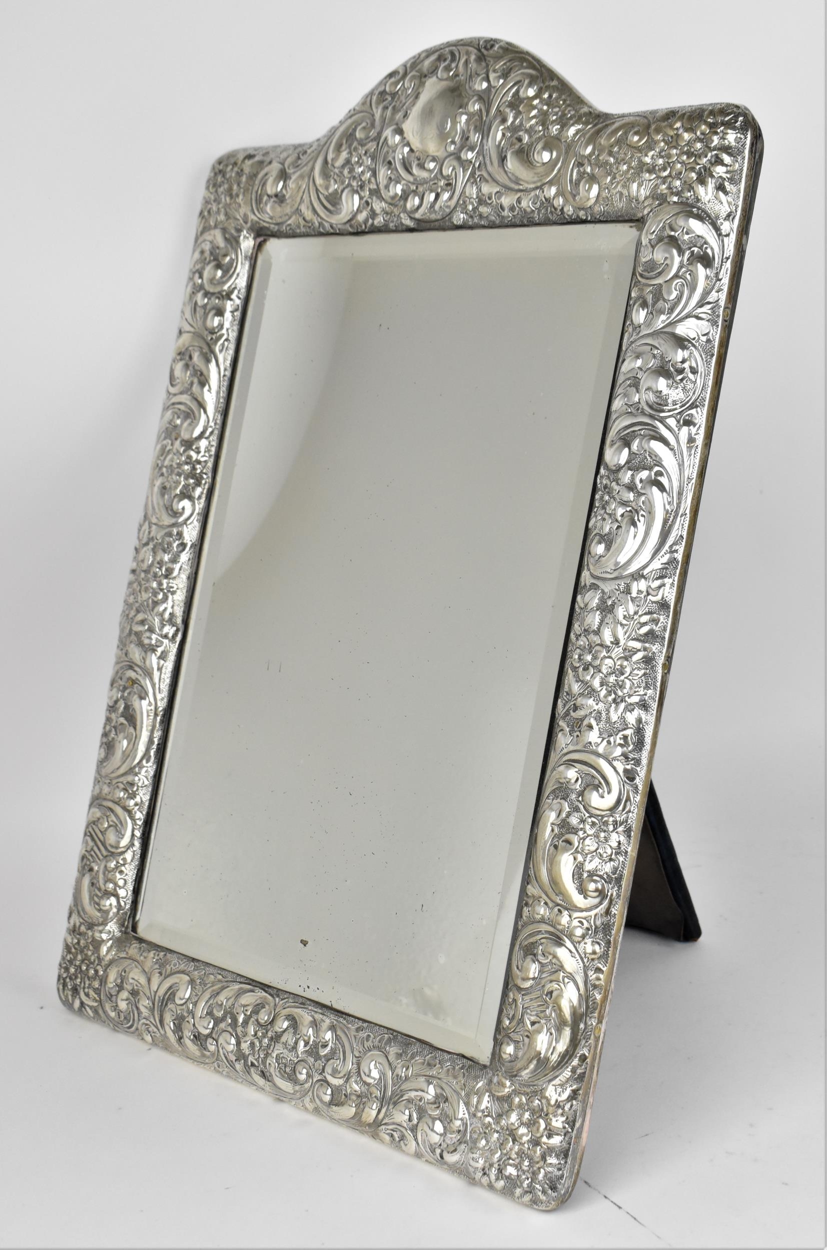 An Edwardian silver mounted dressing table mirror, Birmingham 1904, the frame with embossed c- - Image 2 of 9