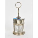 An early 20th silver and enamel four-section scent bottle stand, each triform perfume flask with