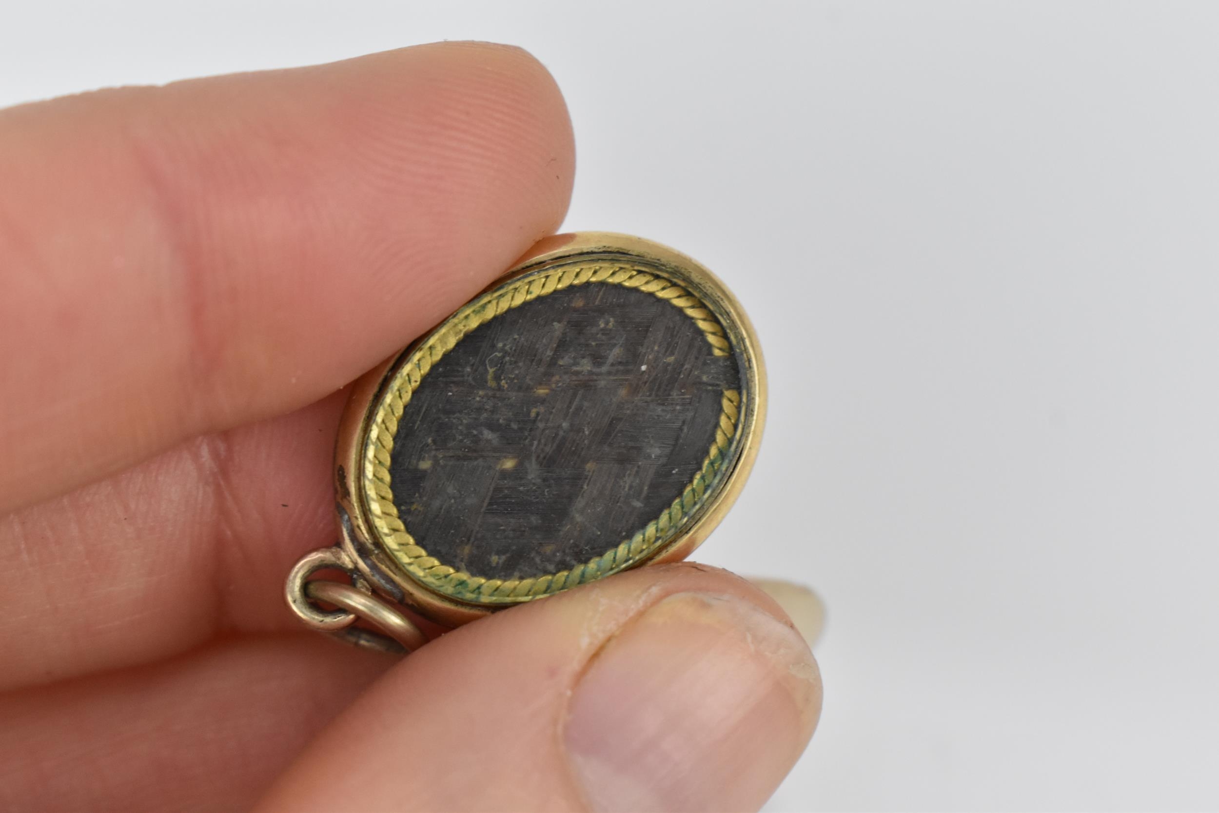 Two Victorian mourning pendants and a brooch, comprising two with braided hair, the third one with - Image 4 of 5