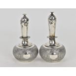 A pair of Victorian silver rosewater sprinklers by George Fox, London 1869, designed with globular