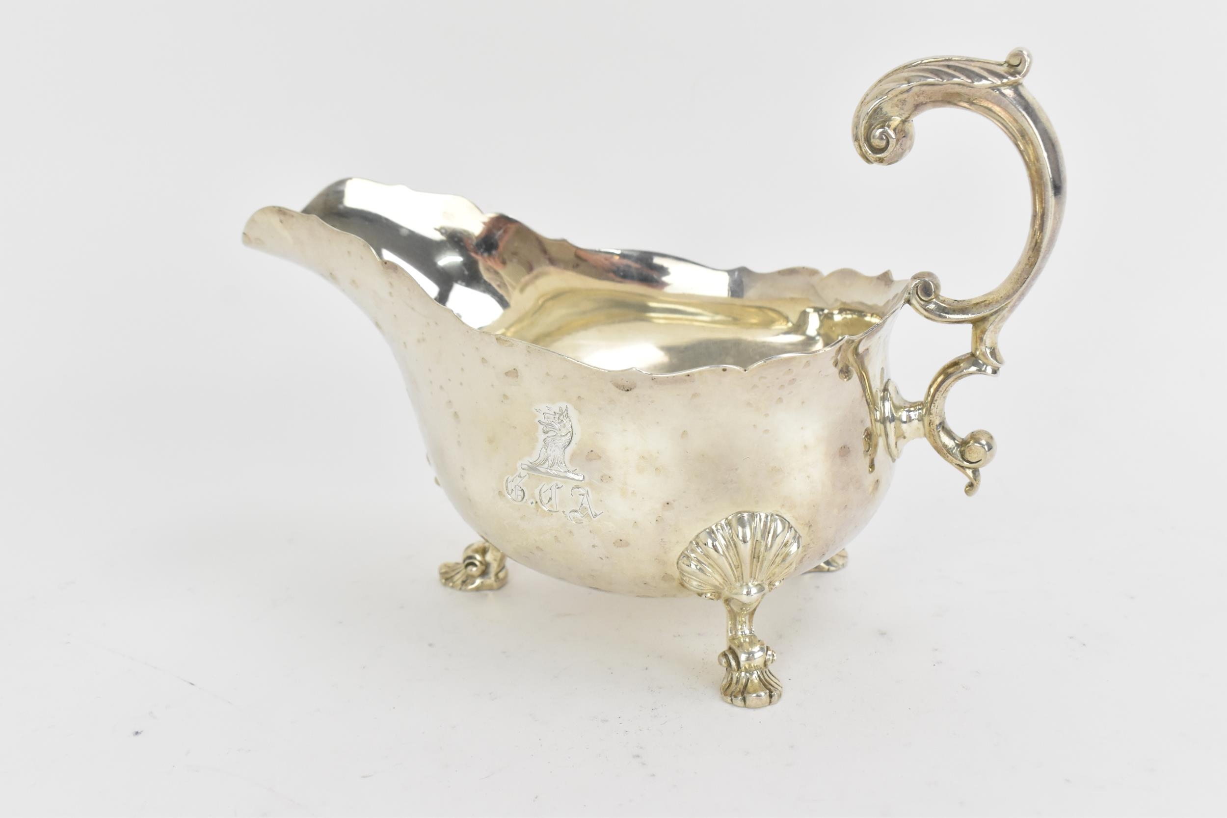 A large George III silver sauce boat by Robert Garrard II, London 1825, with pinched rim and c- - Image 2 of 6