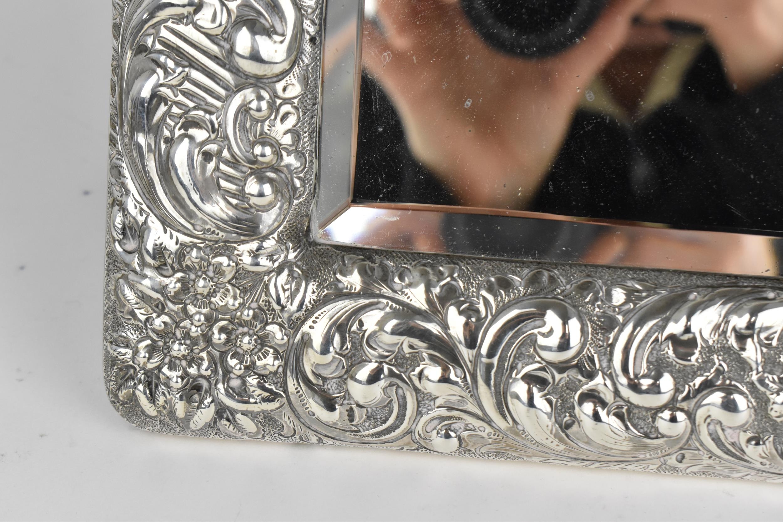 An Edwardian silver mounted dressing table mirror, Birmingham 1904, the frame with embossed c- - Image 6 of 9