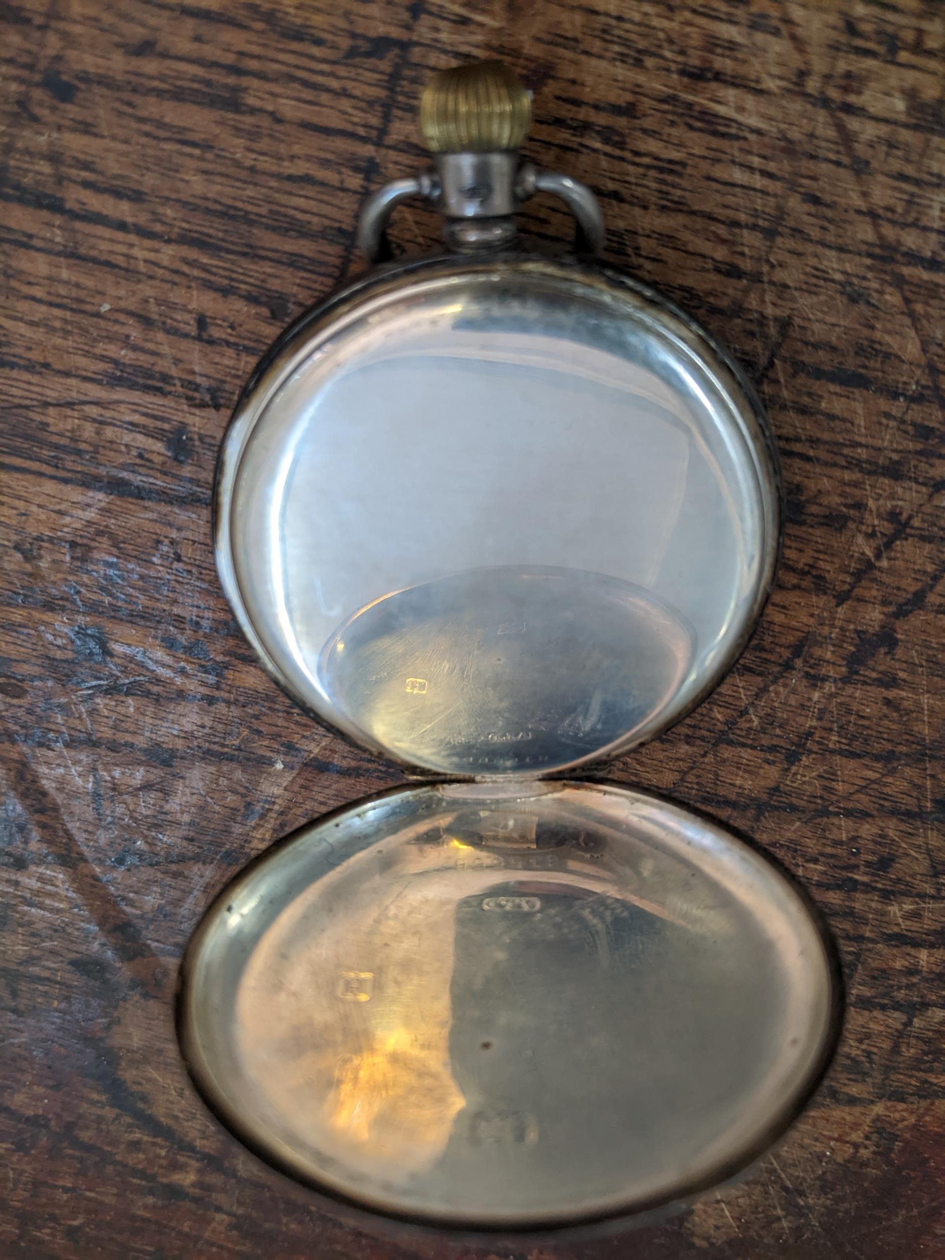 An early 20th century manual-wind half-hunter pocket watch, in silver Dennison case, with blue - Image 4 of 4