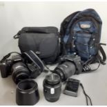 A quantity of cameras to include two Olympia E500 digital cameras with lens, carols, accessories and