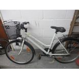 A Shimano Travel white painted bicycle with front carrying basket Location: