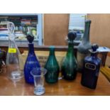 A group of 19th century coloured and cut glass decanters to include Brandy and Rum Bristol Green and