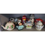 A collection of novelty teapots to include The Silver Crane Company motorbike and rider teapot,
