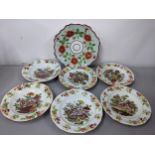 A set of six 19th century Staffordshire plates and another decorated with roses and relief