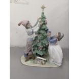 A boxed Lladro 5897 porcelain figure group entitled 'Trimming The Tree' Location: