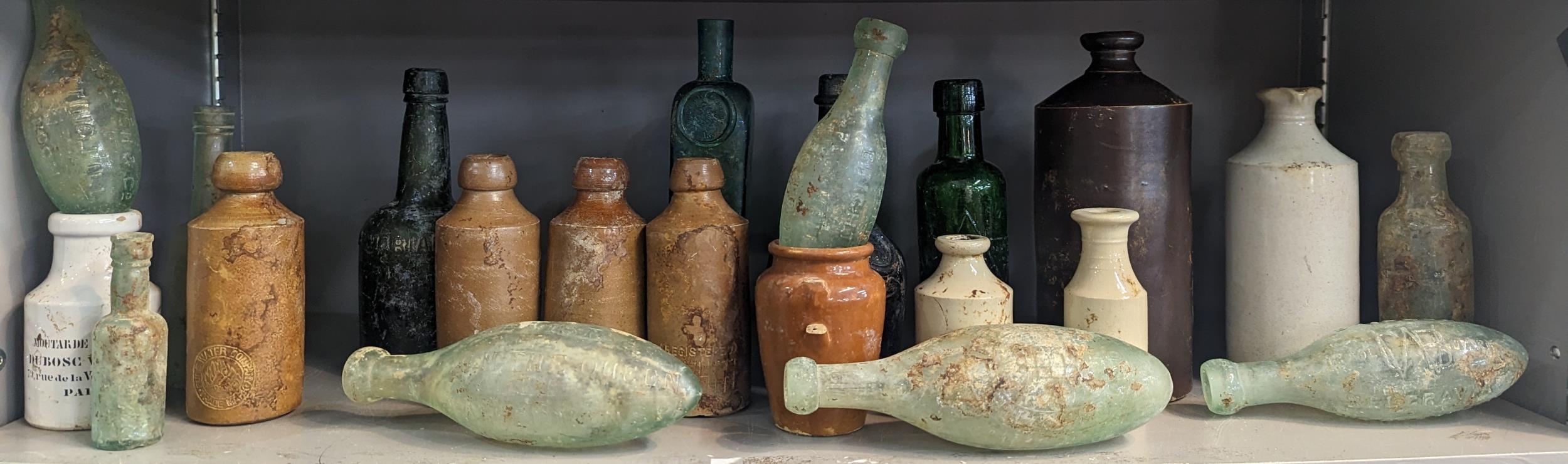 A group of mixed 18th/19th century glass and stoneware bottles and flasks A/F, to include