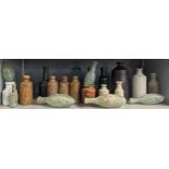 A group of mixed 18th/19th century glass and stoneware bottles and flasks A/F, to include