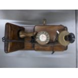 A vintage wall mounted telephone Location: