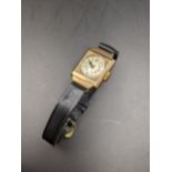 A ladies 9ct gold cased wristwatch on a leather strap, Location: