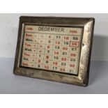A 1930's silver framed desk calendar, 8cm x 10.5cm Location: TABLE