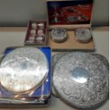 Silver plate to include placemats, a tray, teaware and other items to include metal chargers,
