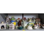 A quantity of novelty teapots to include a Disney Donald Duck teapot, a vintage car teapot, Tony