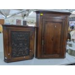 A Georgian oak corner cabinet, together with an early 20th century oak corner cabinet having a