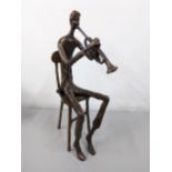 Bernard Kim (B.1942) a patinated bronze sculpture of a man playing the trumpet Location: