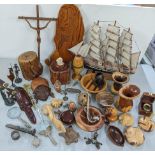 A mixed lot to include treen items, carved bowls, tribal faces, reptiles and others together with