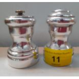 A pair of sterling silver and wooden grinder and pepper pots, Location